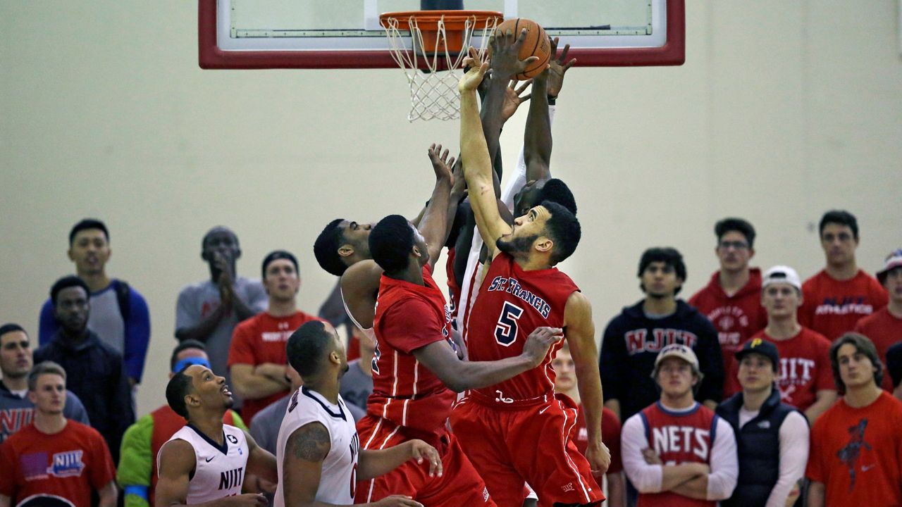 St. Francis of Brooklyn's Jalen Cannon tries to grab a rebound in a game against NJIT on Tuesday, Dec. 9, 2014 in Newark.