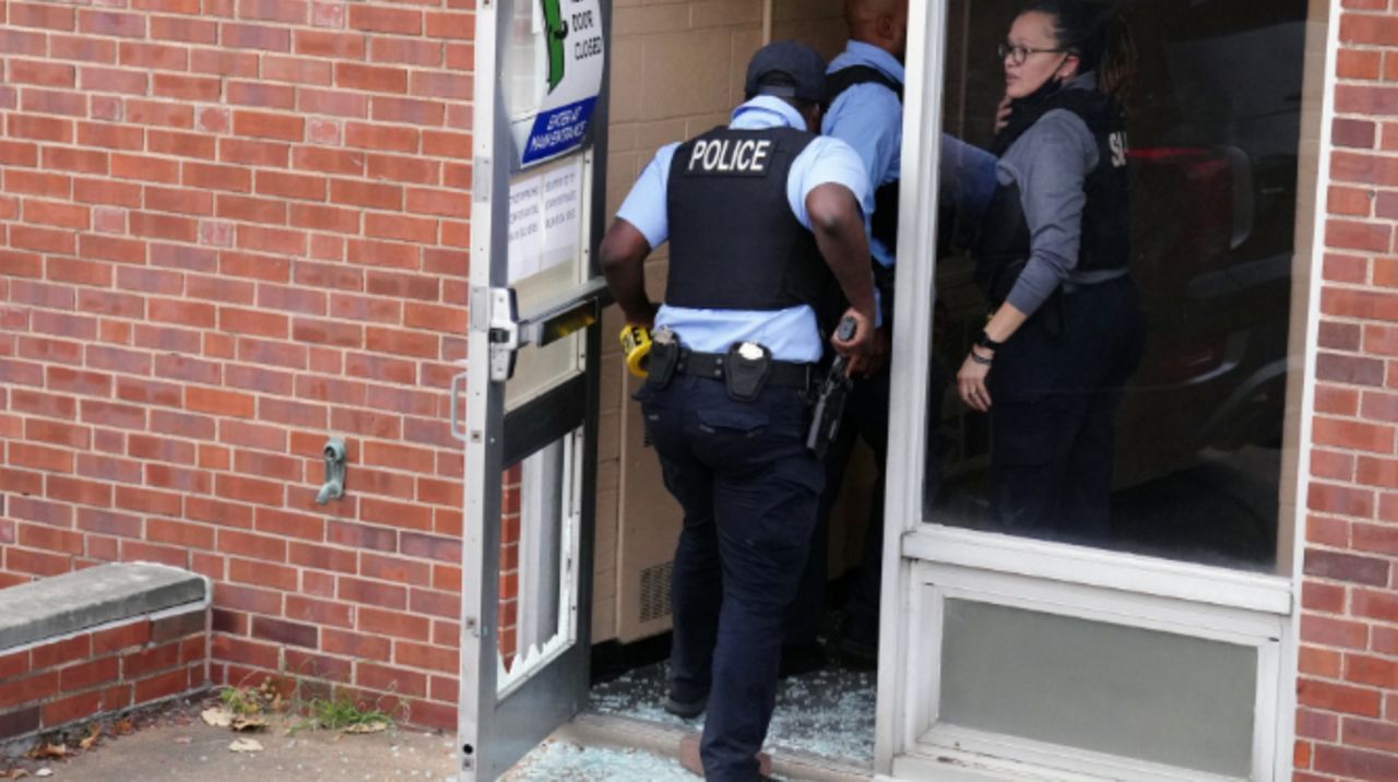 St. Louis Police hold their guns as they enter the Central Visual and Performing Arts High School through a door where a gunman entered after breaking the glass in St. Louis on Monday, October 24, 2022. Three people are dead, including the gunman, who appeared to be in his 20's. Eight others were transported to area hospitals. Police have not disclosed the shooter's connection to the school.   Photo by Bill Greenblatt/UPI