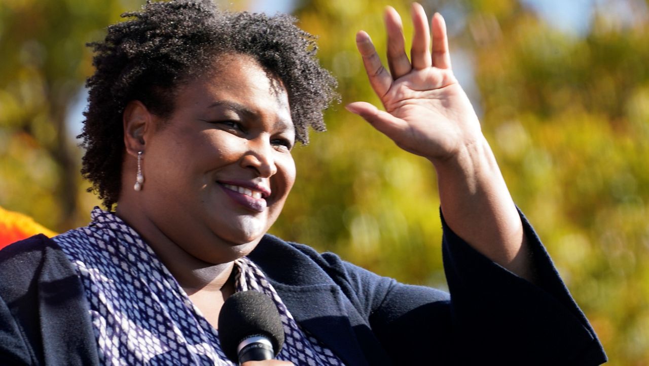 In this Monday, Nov. 2, 2020, file photo, Stacey Abrams speaks to Biden supporters as they wait for former President Barack Obama to arrive and speak at a campaign rally for Biden at Turner Field in Atlanta. (AP Photo/Brynn Anderson, File)