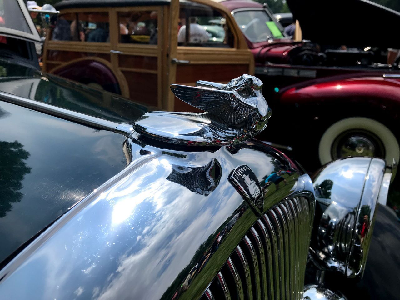 a close up of a classic vehicle's hood ornament