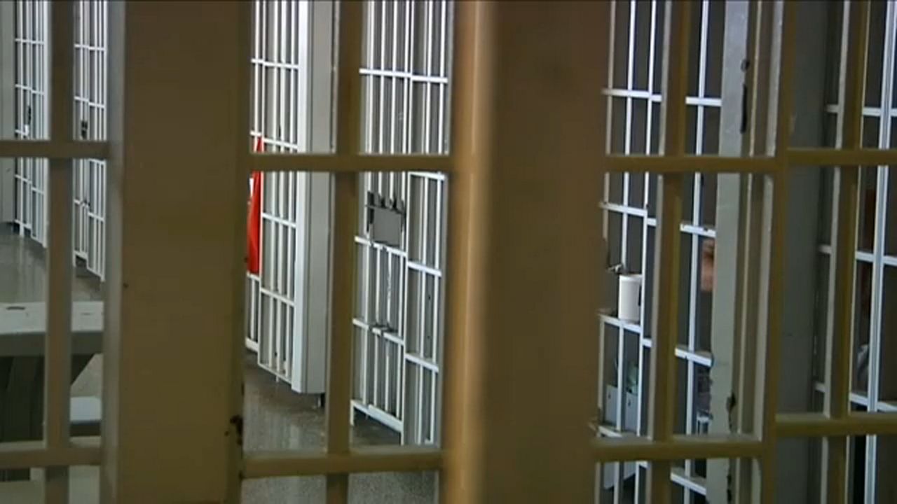 File photo of jail bars. (Spectrum News/File)