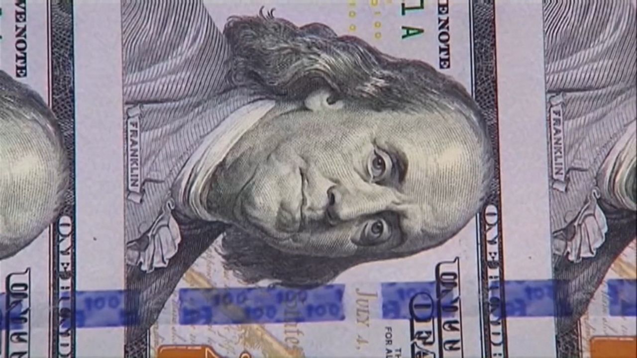 U.S. currency being printed.