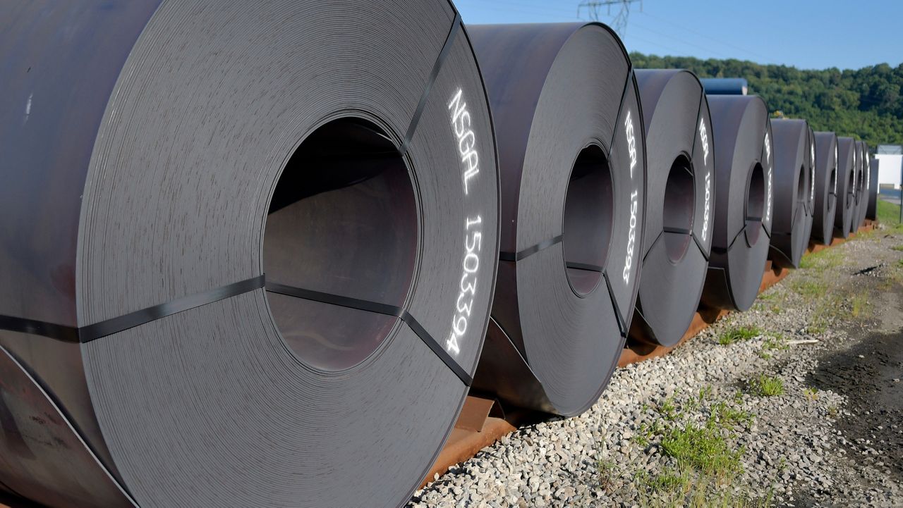 Rolls of steel await shipment at the Nucor Steel Gallatin plant, Wednesday, July 25, 2018, in Ghent, Ky. The steel maker has announced that it will build a $350 million manufacturing plant in Lexington, N.C., which would be its second in the state. (AP Photo/Timothy D. Easley)