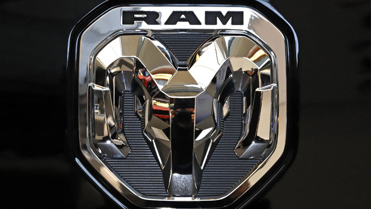 FILE - This Feb. 13, 2020 photo shows the Ram truck logo at the 2020 Pittsburgh International Auto Show in Pittsburgh. (AP Photo/Gene J. Puskar)