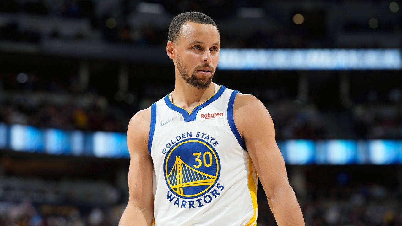 Golden State Warriors guard Steph Curry in the second half of Game 3 of an NBA basketball first-round Western Conference playoff series Thursday, April 21, 2022, in Denver. (AP Photo/David Zalubowski)