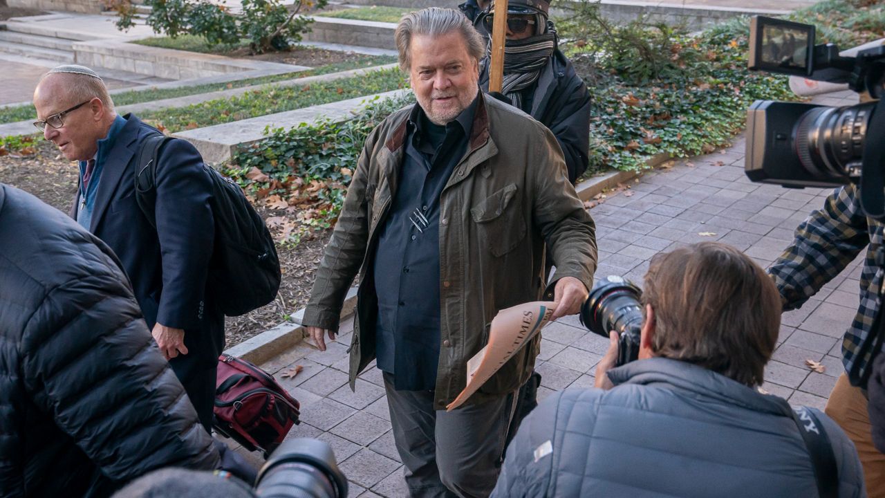 Steve Bannon, center, a longtime ally of former President Donald Trump, arrives Friday at federal court for a sentencing hearing in Washington. (AP Photo/Nathan Howard)