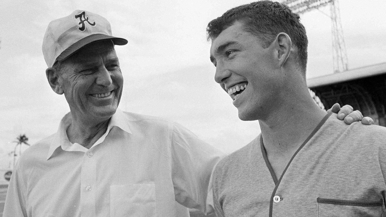 Steve Sloan, pictured with former Alabama coach Bear Bryant (left) in 1968 went on to become athletic director for the Crimson Tide and for the UCF Knights. (AP Photo/Harold Valentine, File)