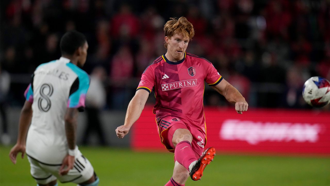 St. Louis City's Tim Parker, right, passes around Minnesota United's Joseph Rosales (8) during the second half of an MLS soccer match Saturday, April 1, 2023, in St. Louis. (AP Photo/Jeff Roberson)