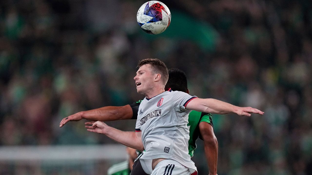 St Louis City SC Joakim Nilsson heads the ball past Austin FC defender Nick Lima during the second half of an MLS soccer match in Austin, Texas on Saturday, Feb. 25, 2023.