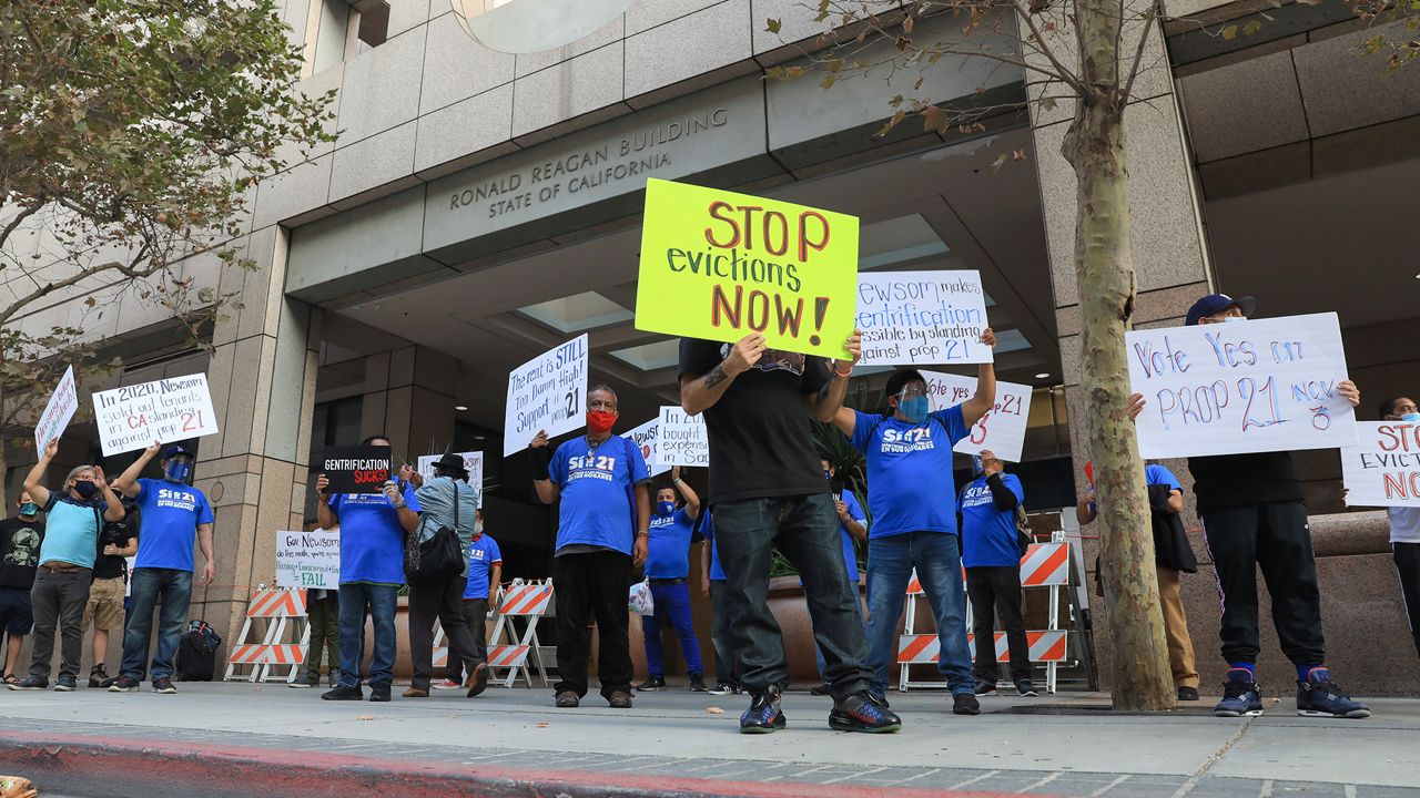 Housing and health care advocates for California's Proposition 21 staged a socially distanced rally and car caravan to protest California Gov. (Mark Von Holden/AP Images for AIDS Healthcare Foundation)