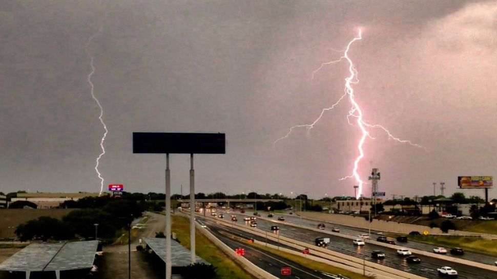 In this photo looking northbound along U.S. 281 in San Antonio, two bolts of lightning appear in this image from April 25, 2018. (Source: Tommy Hughen/Twitter)