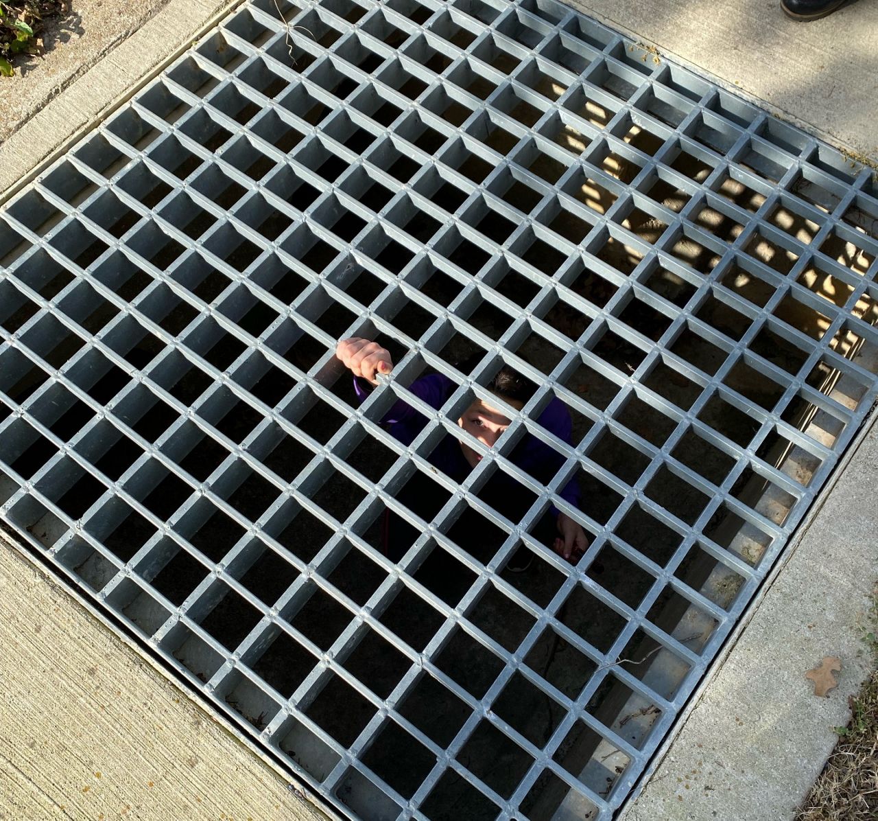Twelve-year-old Tori appears beneath a sewage grate in Southlake, Texas, in this image from January 2022. (Southlake DPS)
