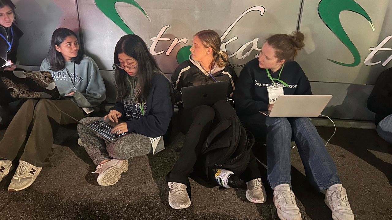 Staff members of the Columbia Daily Spectator, the college newspaper, work into the night as police cleared out demonstrators from Columbia University's campus, late Tuesday, April 30, 2024, in New York.