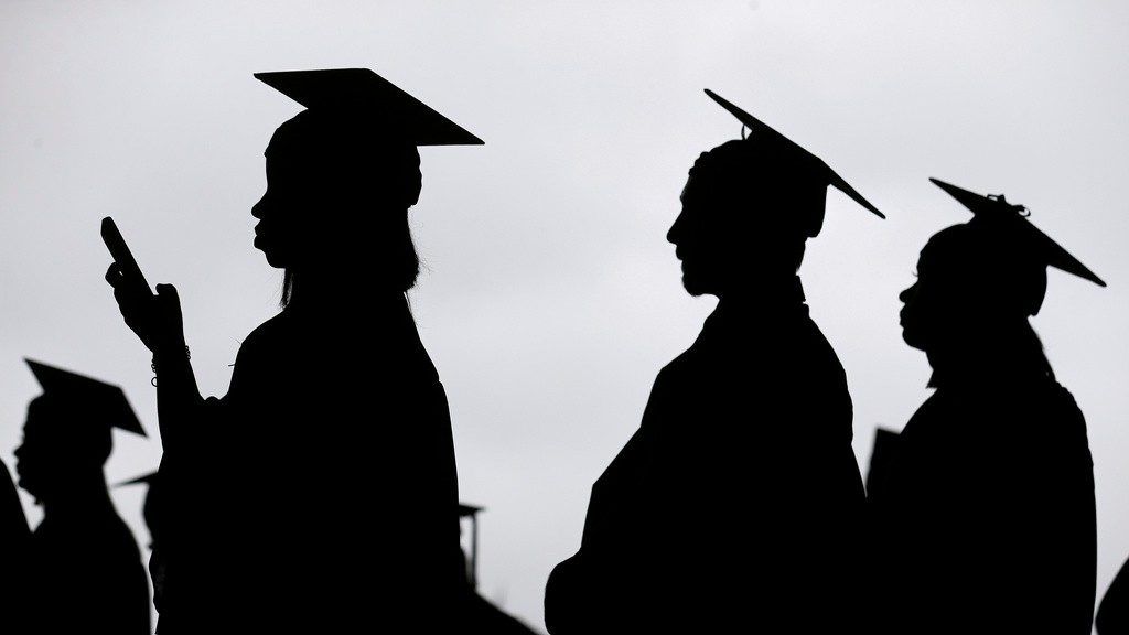 New graduates line up before the start of a community college commencement in East Rutherford, N.J., on May 17, 2018. (AP Photo/Seth Wenig, File)