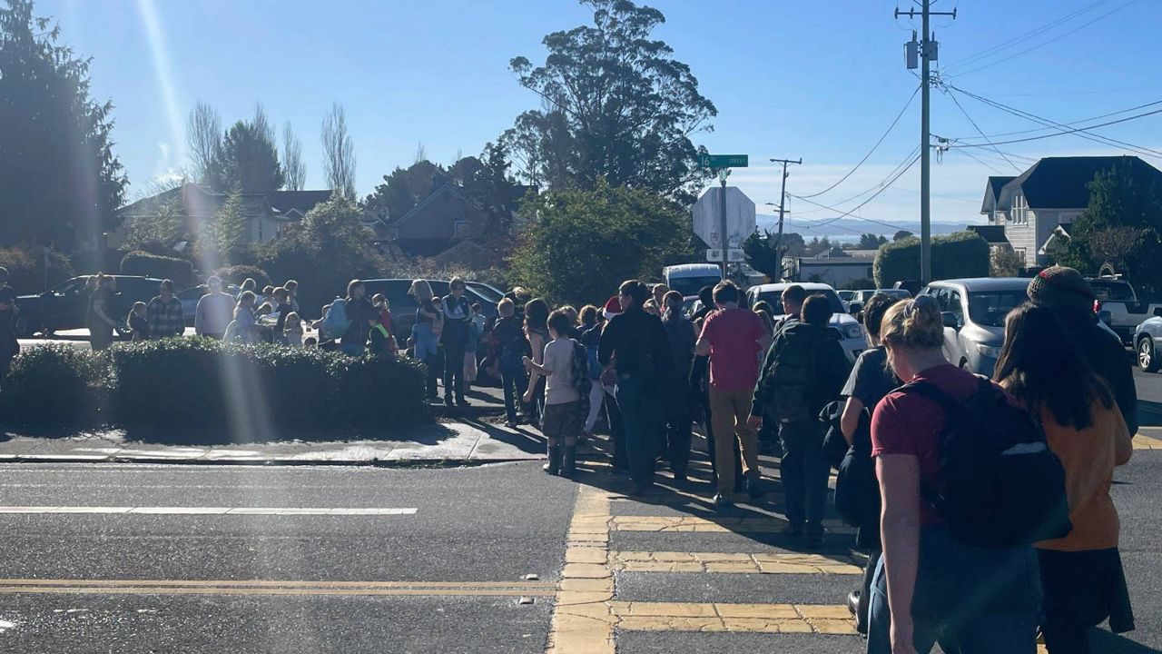 Students walk in line as they are evacuated from Laurel Tree Charter School to Arcata High School after an earthquake Thursday in Arcata, Calif. (Sage Alexander/The Times-Standard via AP)