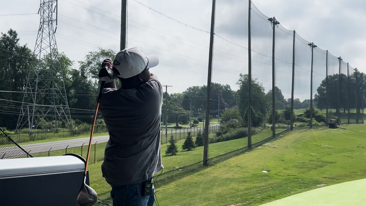 Zaire Williamson golfing at Top Golf. 