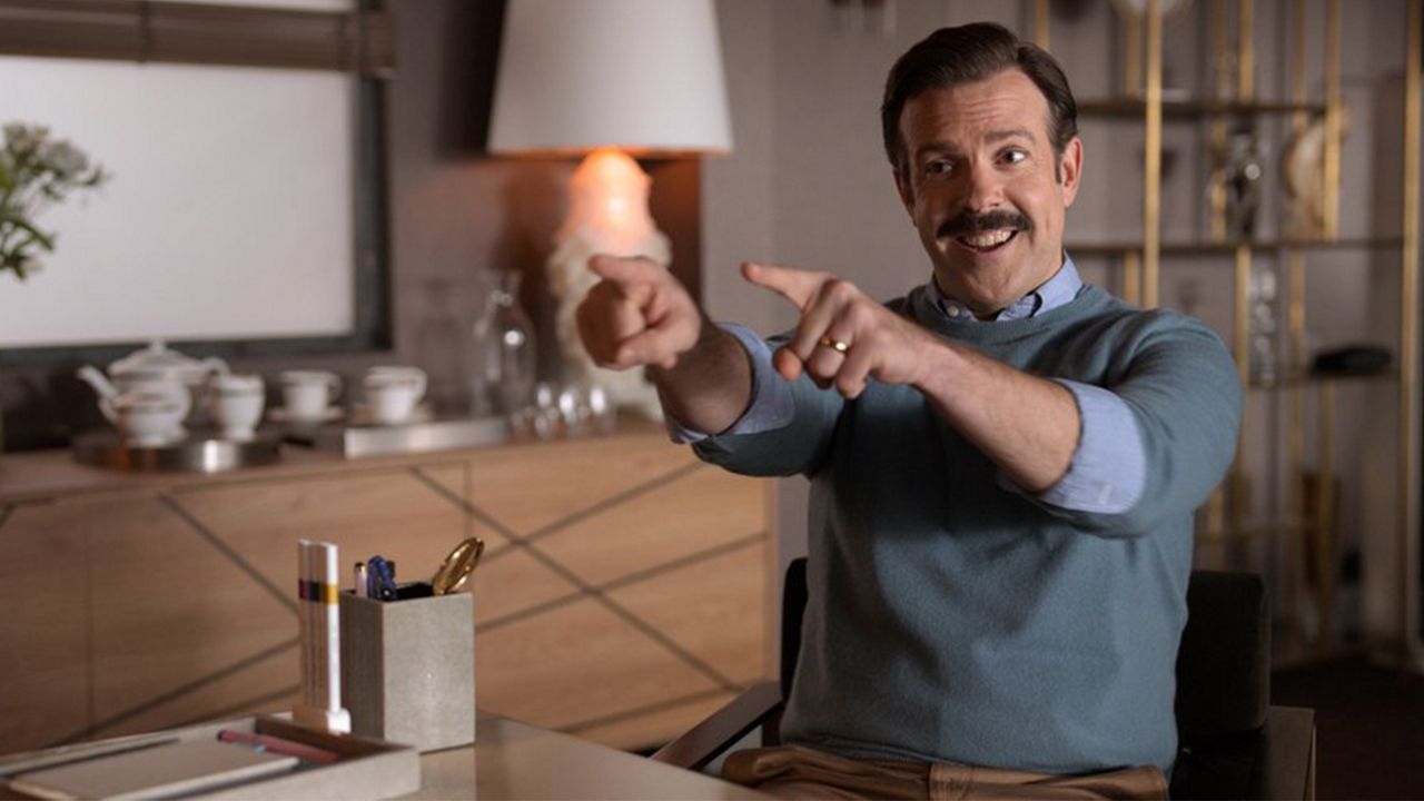 This image released by Apple TV Plus shows Jason Sudeikis in "Ted Lasso." Sudeikis accepted the award for best actor in a television series, musical or comedy at the Golden Globe Awards on Sunday, Feb. 28, 2021. (Apple TV Plus via AP)