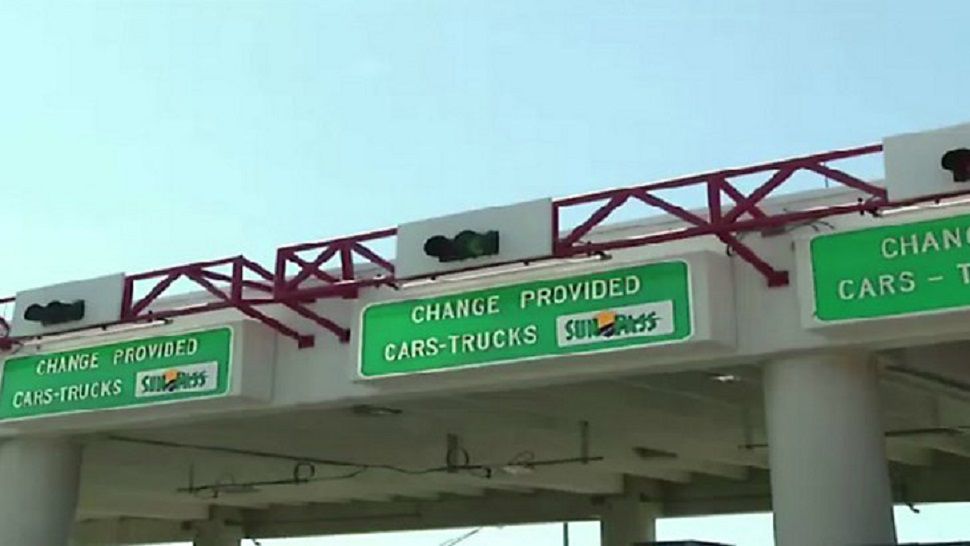 Signage over SunPass toll lanes.