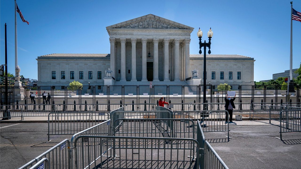 Pens for protesters are set up Tuesday near anti-scaling fencing that blocks off the stairs to the Supreme Court. (AP Photo/Jacquelyn Martin)