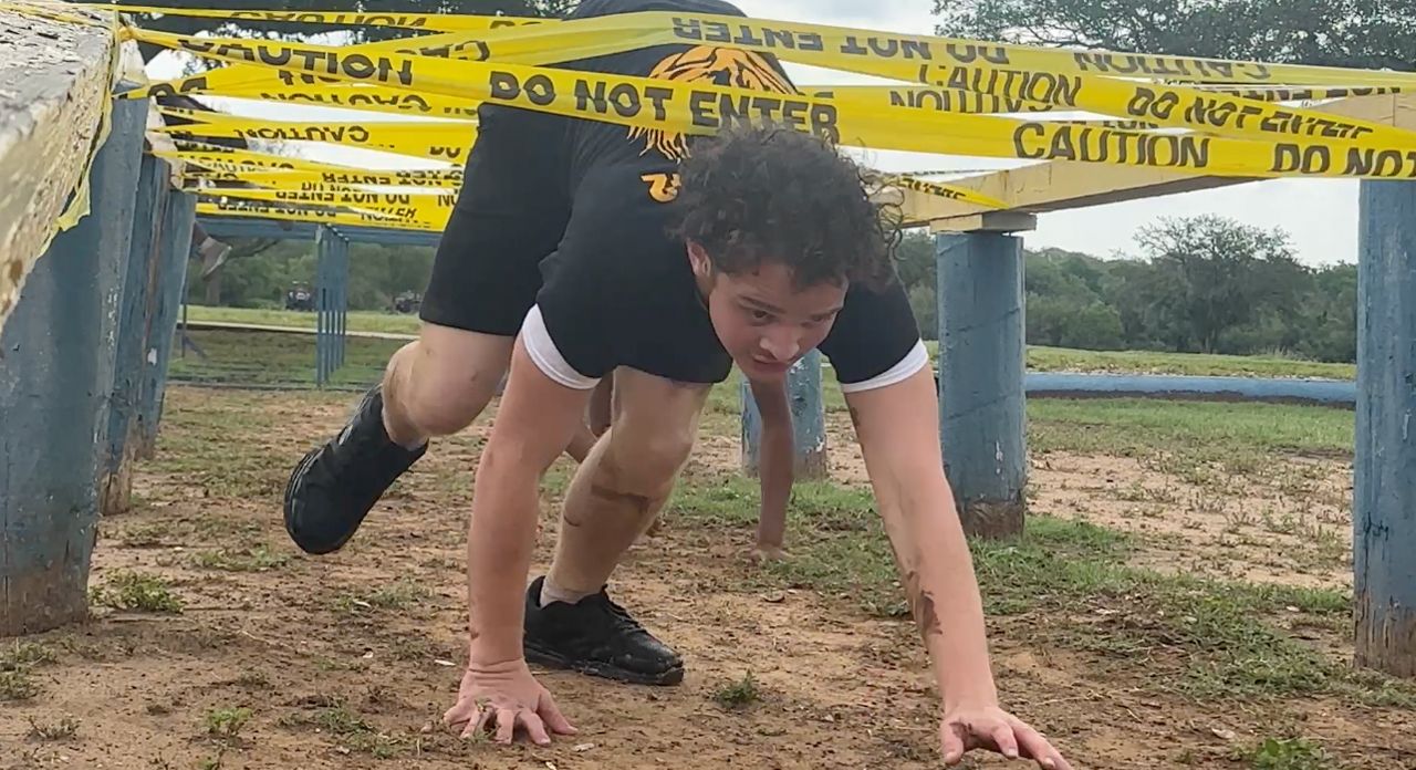 A participant in the San Antonio SWAT Challenge races through a section of the course. (Spectrum News 1/Bryan Boes)