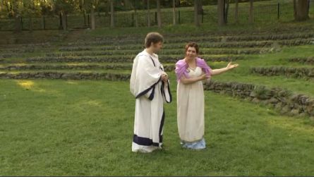 Shakespeare in the Park actors in Grecian dress stand in Thornden Park. 