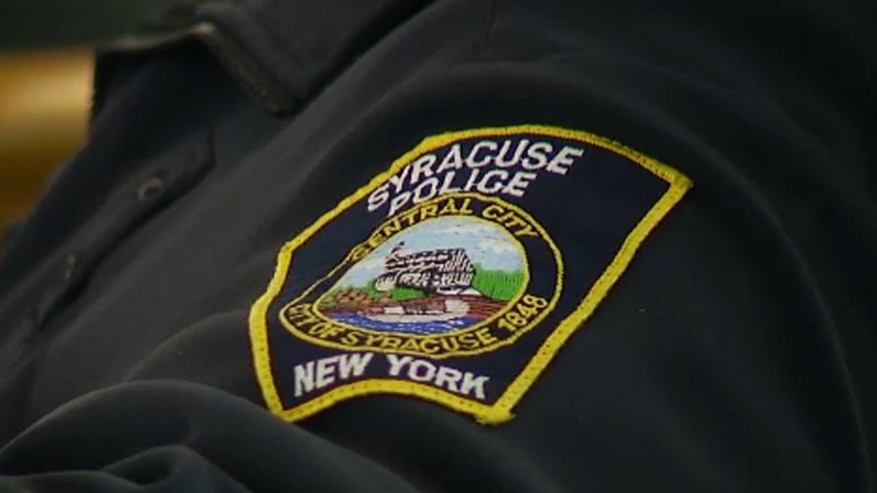 Syracuse Police talking to someone 