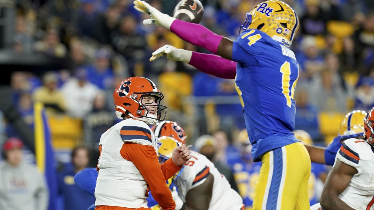 pittsburgh defender jumps and bats down syracuse quarterback's pass