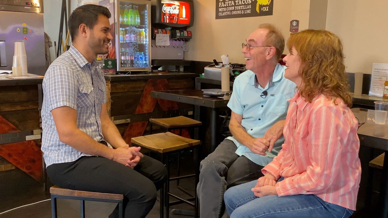 Spectrum News 1 human interest reporter Lupe Zapata chats with owners of The Local Taco Paul and Mary Alaniz, whose downtown Dallas restaurant has struggled to match pre-pandemic business. (Spectrum News 1/Lupe Zapata)