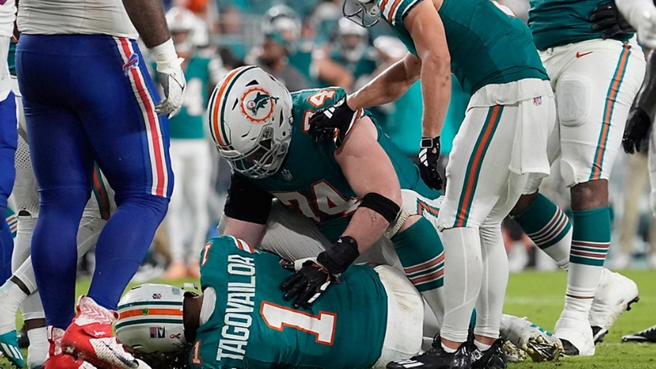 Miami Dolphins quarterback Tua Tagovailoa (1) lies on the field after suffering a concussion during the second half of an NFL football game against the Buffalo Bills, Thursday, Sept. 12, 2024, in Miami Gardens, Fla. (AP Photo/Lynne Sladky)