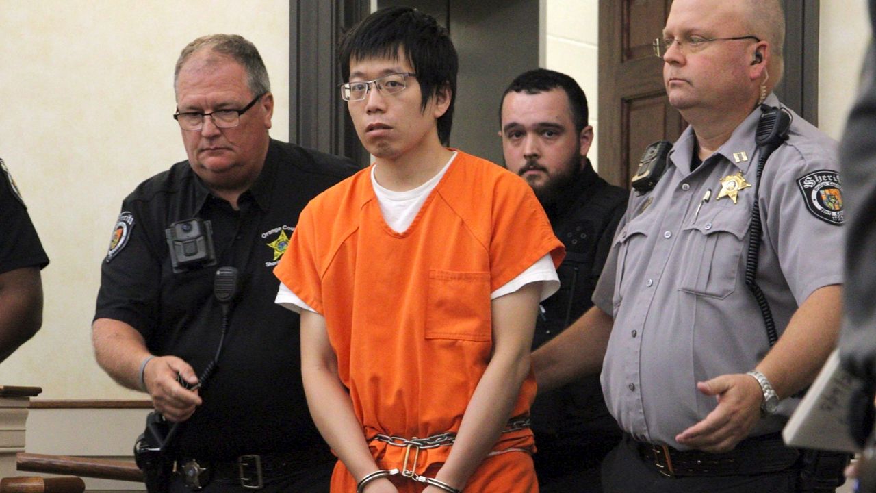 Tailei Qi, the graduate student suspected in the fatal shooting of a UNC-Chapel Hill faculty member, center, makes his first appearance at the Orange County Courthouse in Hillsborough, N.C., on Tuesday, Aug. 29, 2023. (AP Photo/Hannah Schoenbaum)