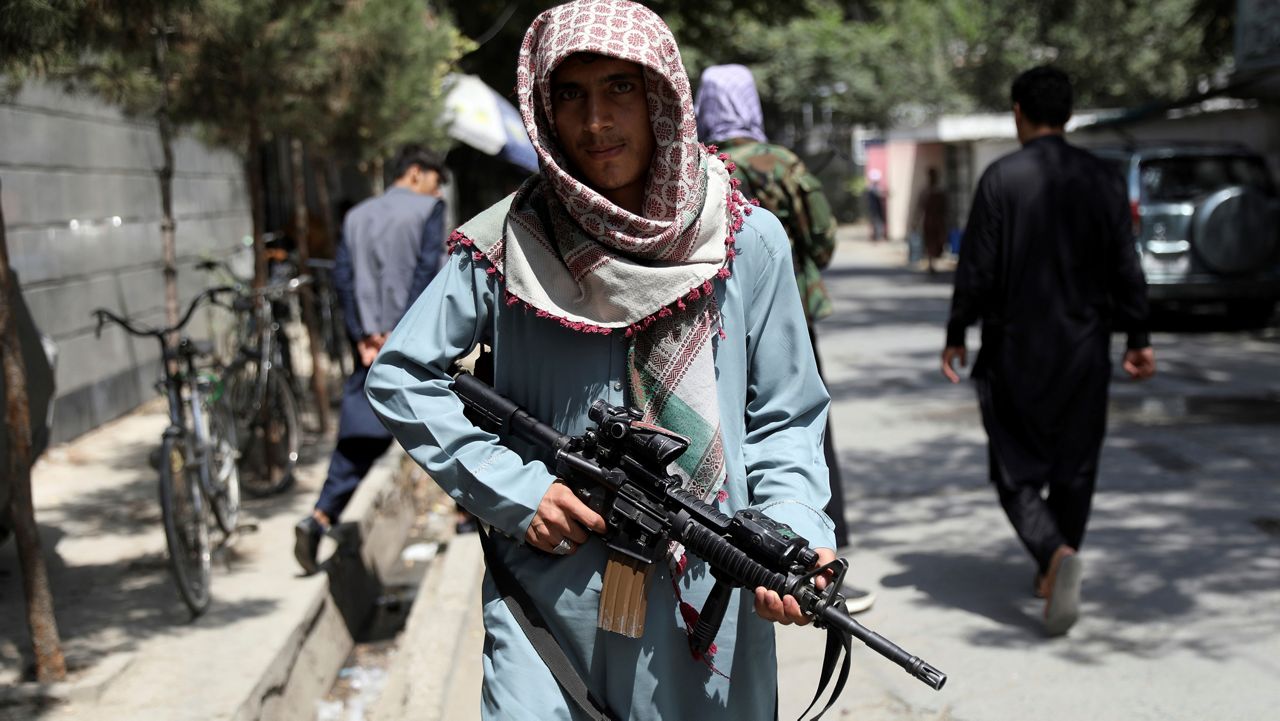 A Taliban fighter stands guard at a checkpoint in the Wazir Akbar Khan neighborhood in the city of Kabul, Afghanistan.  (AP Photo/Rahmat Gul)