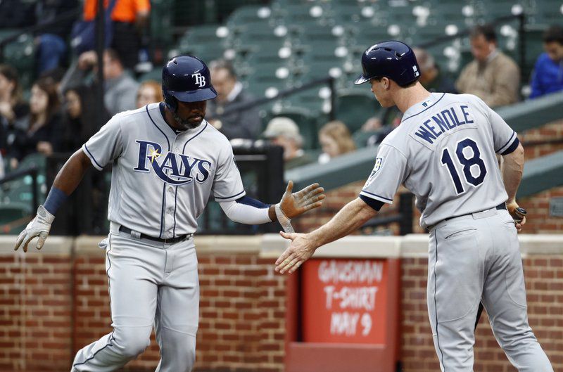 Tampa Bay Rays’ Denard Span, left, greets teammate Joey Wendle after scoring on Brad Miller’s groundout during the first inning of a baseball game against the Baltimore Orioles, Wednesday, April 25, 2018, in Baltimore. (AP Photo/Patrick Semansky)