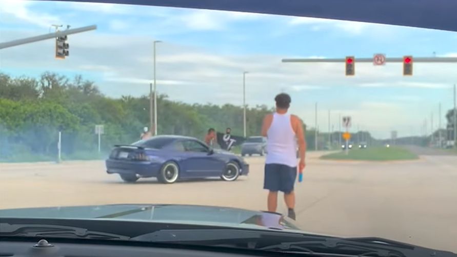 A blue Mustang does donuts in a Tampa intersection at Madison Avenue and South 50th Street. (Hillsborough County Sheriff's Office)