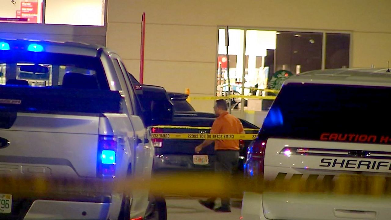 Law enforcment personnel respond to the scene of a deadly shooting Wednesday night at a Kissimmee Target that involved two Osceola County Sheriff's Office deputies. (Spectrum News)