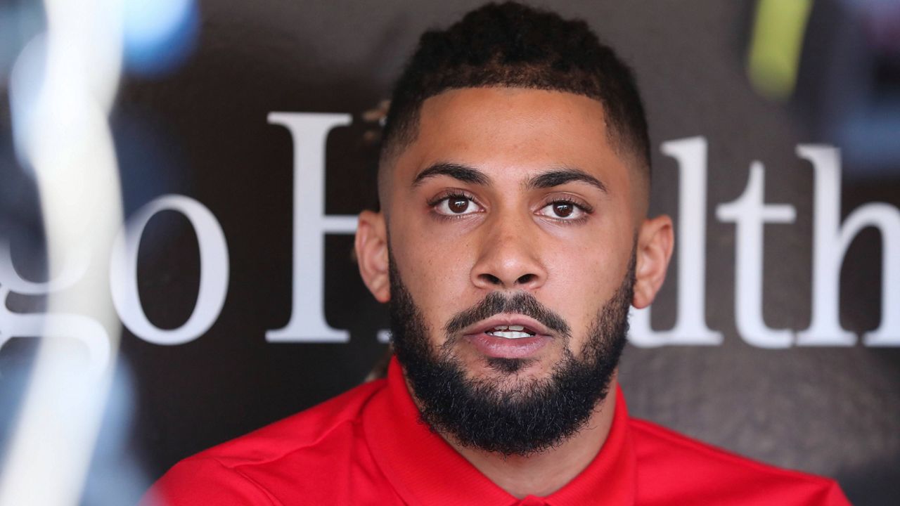 San Diego Padres' Fernando Tatis Jr. speaks to the media about his 80 game suspension from baseball after testing positive for Clostebol, a performance-enhancing substance in violation of Major League Baseball's Joint Drug Prevention and Treatment Program, Tuesday, Aug. 23, 2022, in San Diego. (AP Photo/Derrick Tuskan)