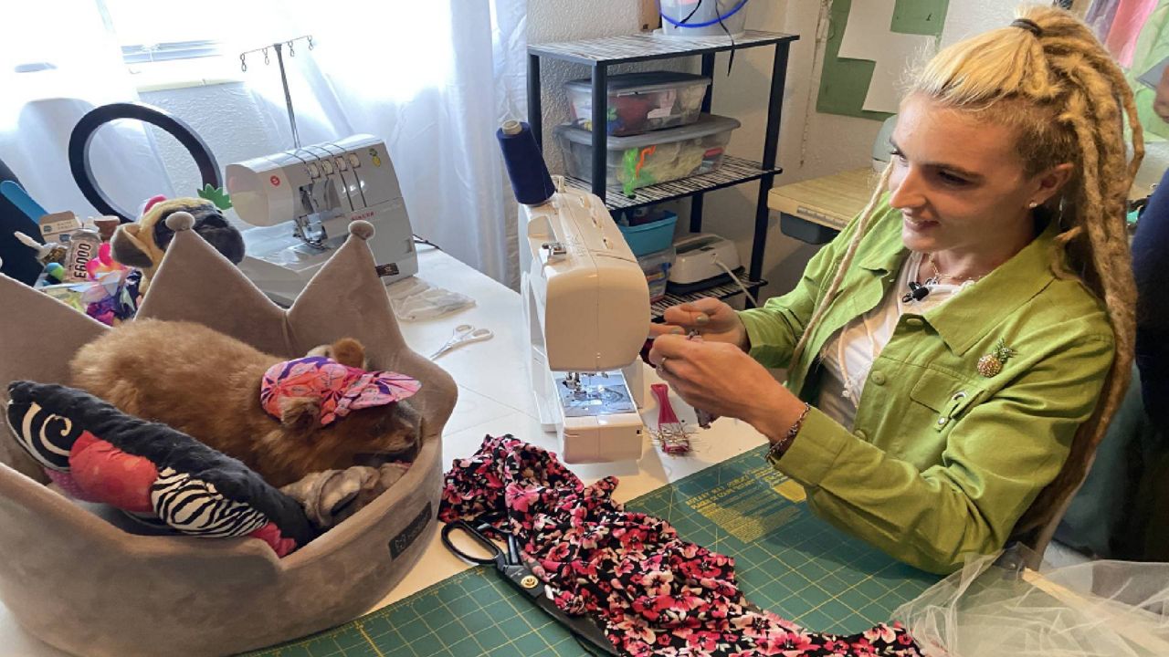 Fashion designer caters to pet owners with upcycled clothing
