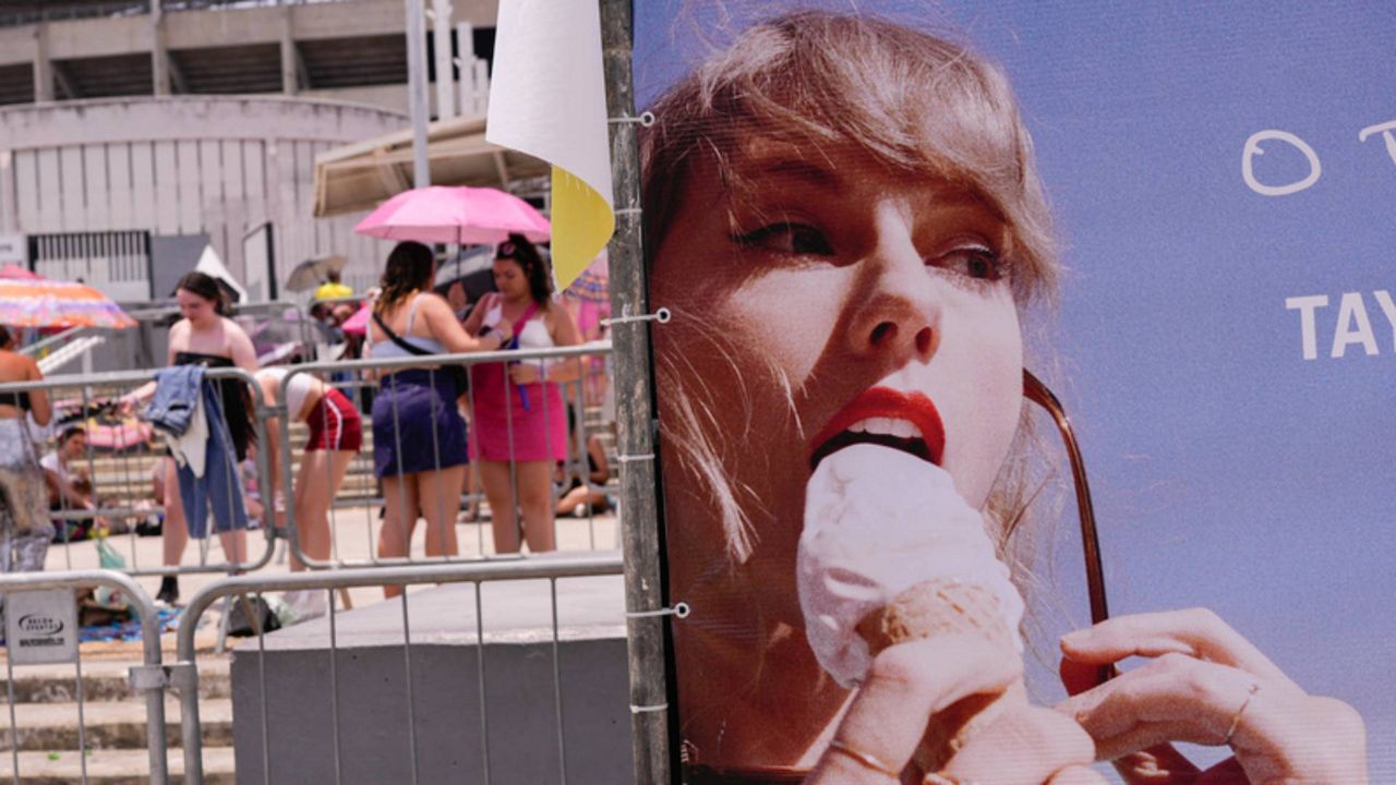 Taylor Swift fans wait for the doors of Nilton Santos Olympic stadium to open for her Eras Tour concert amid a heat wave in Rio de Janeiro on Saturday, Nov. 18, 2023. 