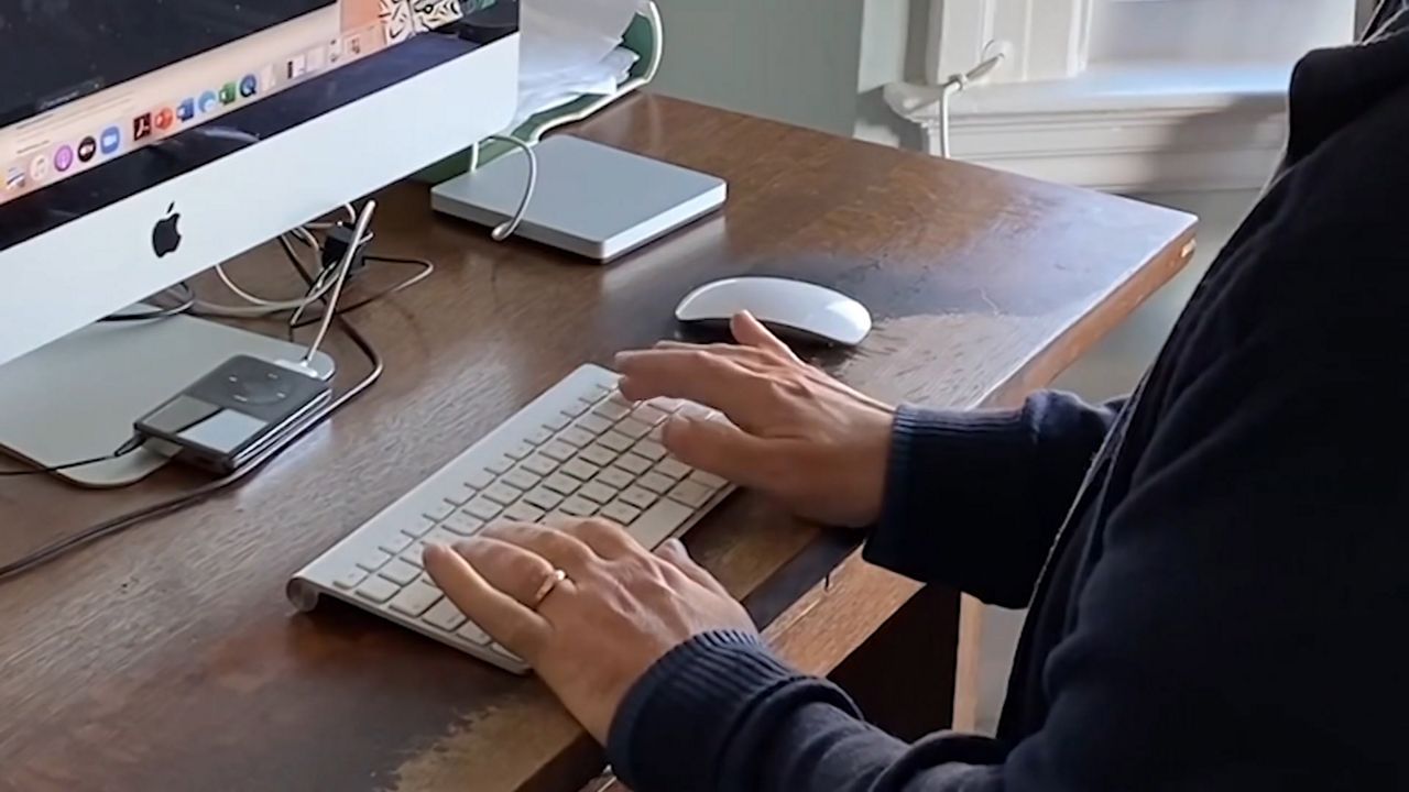 Photo of a woman sitting and working