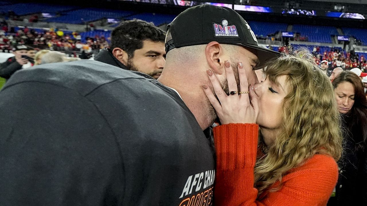 Taylor Swift kisses Kansas City Chiefs tight end Travis Kelce after an AFC Championship NFL football game against the Baltimore Ravens, Sunday, Jan. 28, 2024, in Baltimore. The Kansas City Chiefs won 17-10. (AP Photo/Julio Cortez)