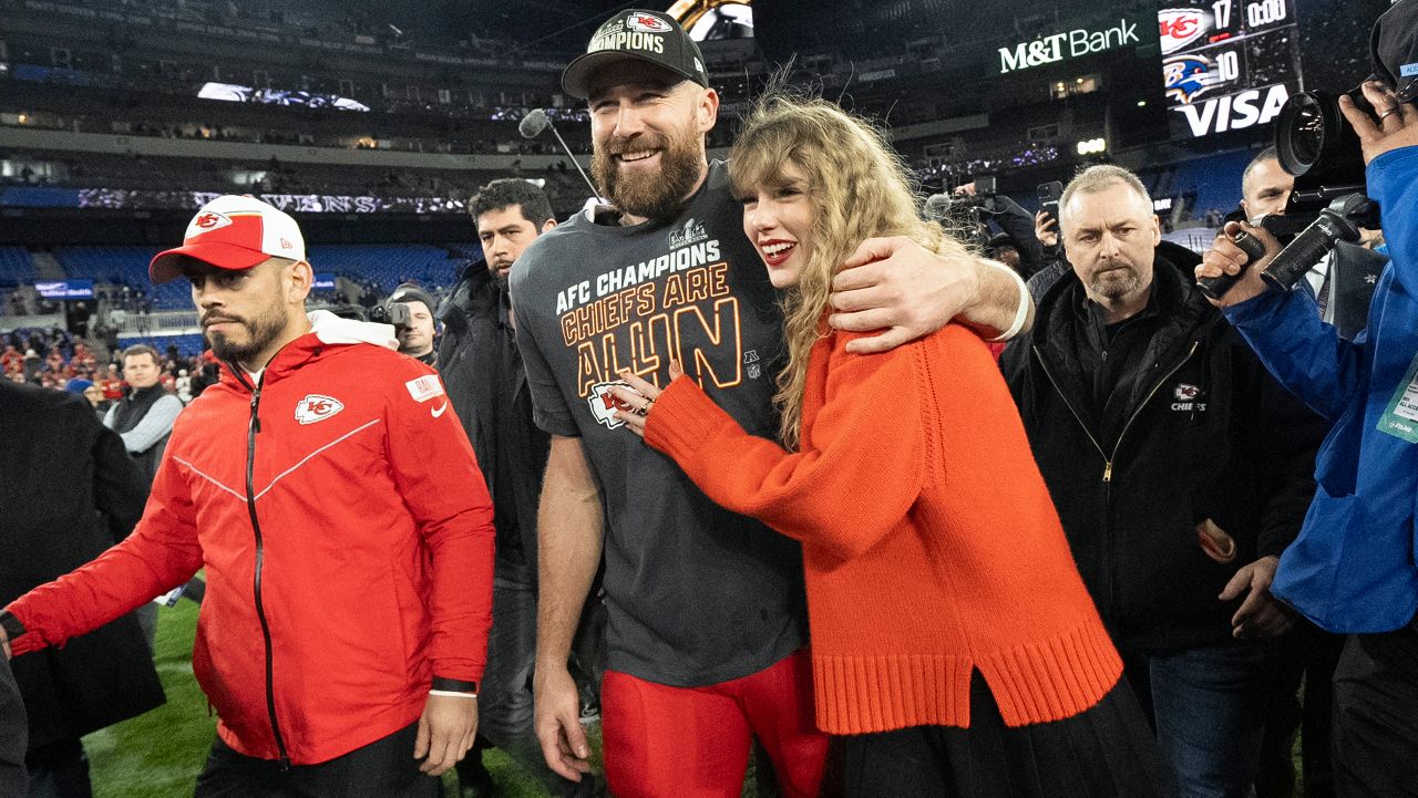 Kansas City Chiefs tight end Travis Kelce and Taylor Swift walk together after an AFC Championship NFL football game between the Kansas City Chiefs and the Baltimore Ravens, Sunday, Jan. 28, 2024, in Baltimore. The Kansas City Chiefs won 17-10. (AP Photo/Julio Cortez)