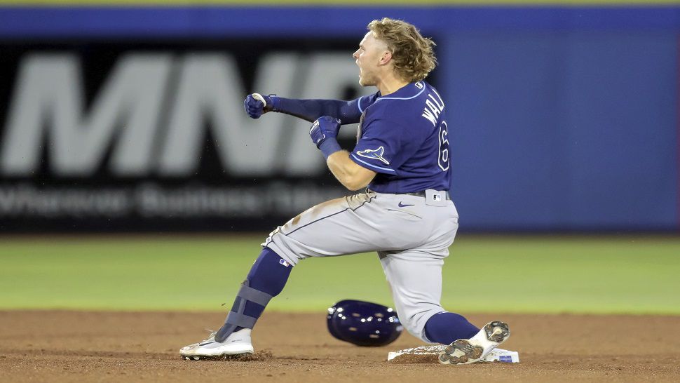 Toronto Blue Jays catcher Danny Jansen (9) gives a forearm bump to