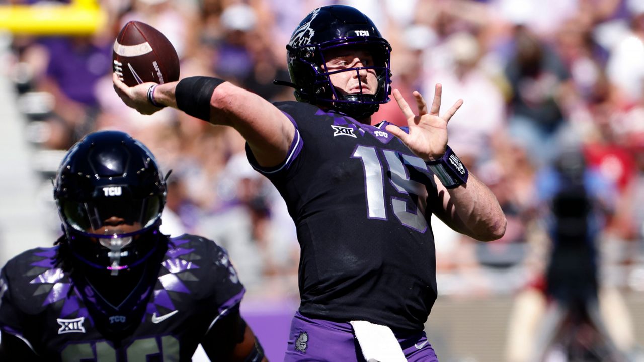 TCU quarterback Max Duggan (15) throws downfield against Oklahoma during the first half of an NCAA college football game Saturday, Oct. 1, 2022, in Fort Worth, Texas. (AP Photo/Ron Jenkins)