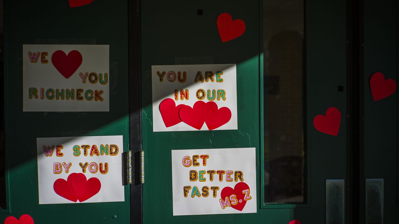 Messages of support for teacher Abby Zwerner, who was shot by a 6-year-old student, cover the front door of Richneck Elementary School Newport News, Va. on Jan. 9, 2023. (AP Photo/John C. Clark, File)