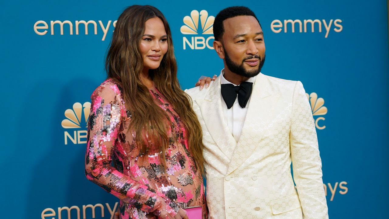 Chrissy Teigen, left, and John Legend arrive Monday at the 74th Primetime Emmy Awards at the Microsoft Theater in Los Angeles. (AP Photo/Jae C. Hong)