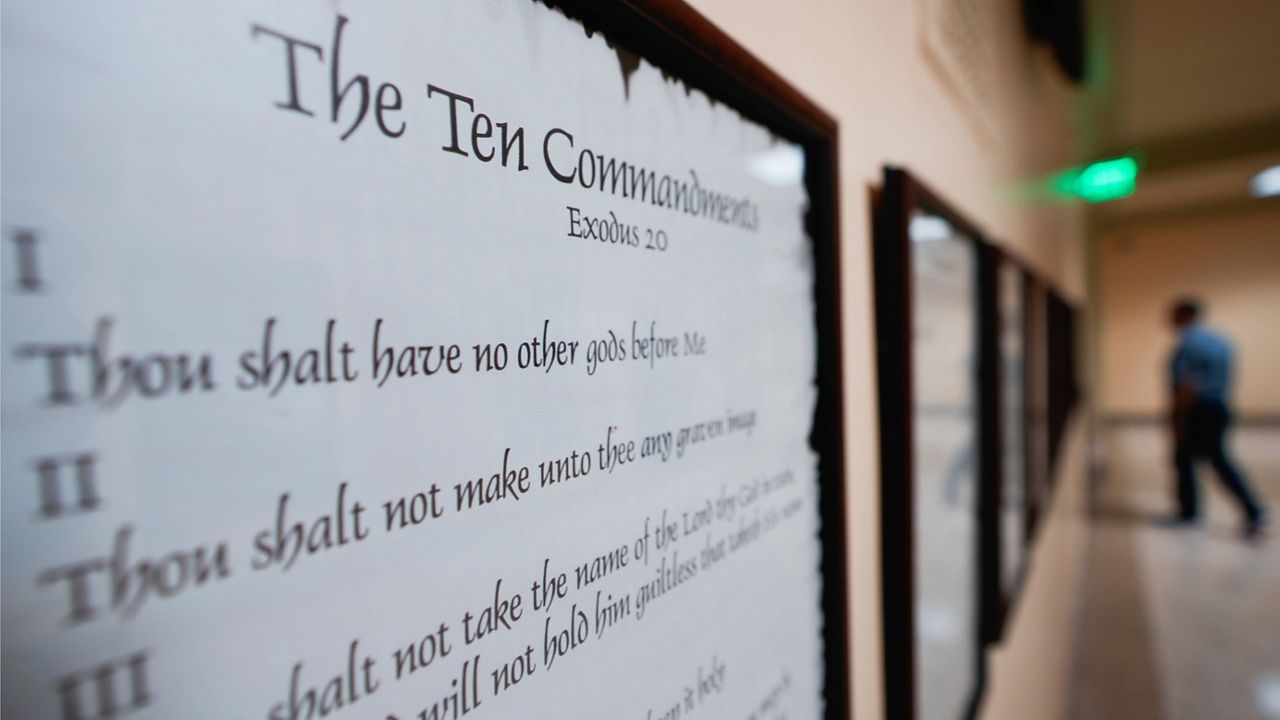 A copy of the Ten Commandments is posted along with other historical documents in a hallway of the Georgia Capitol, June 20, 2024, in Atlanta. (AP Photo/John Bazemore, File)