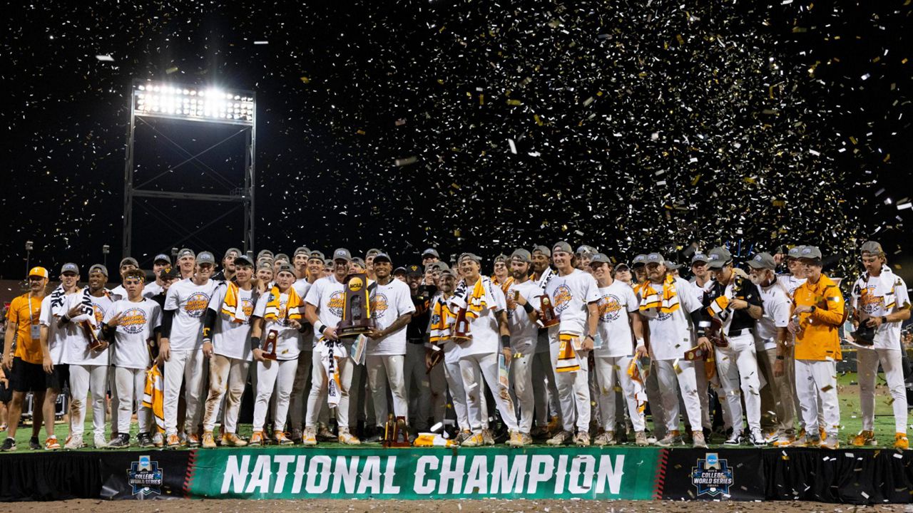 Tennessee holds the championship trophy after their victory over Texas A&M in Game 3 of the NCAA College World Series baseball finals in Omaha, Neb., Monday, June 24, 2024. (AP Photo/Rebecca S. Gratz)