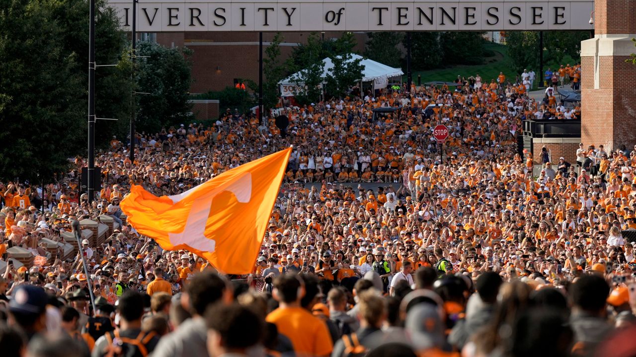 Tennessee fans gather outside Neyland Stadium before an NCAA college football game between Tennessee and Kent State on Saturday, Sept. 14, 2024, in Knoxville, Tenn. (AP Photo/George Walker IV)