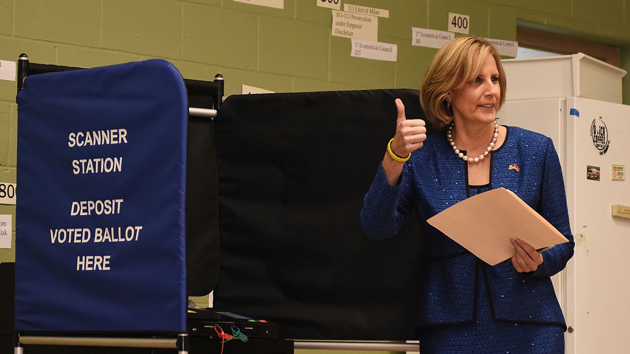 Claudia Tenney at a voting booth