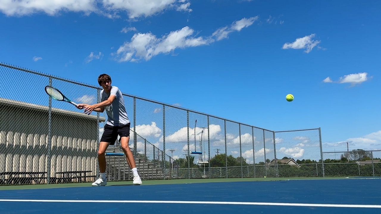 Colin Meixl hitting a tennis ball
