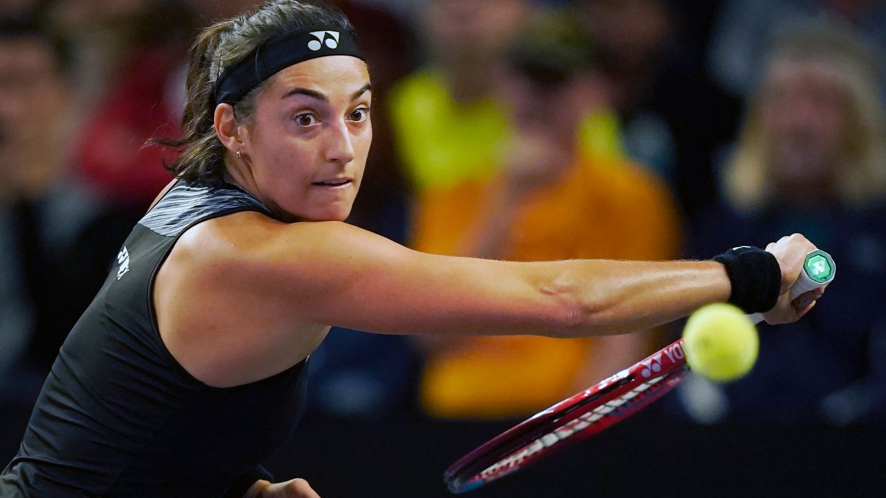 Caroline Garcia of France returns a shot in the third set against Daria Kasatkina of Russia during round-robin play on day six of the WTA Finals tennis tournament in Fort Worth, Texas, Saturday, Nov. 5, 2022. (AP Photo/LM Otero)